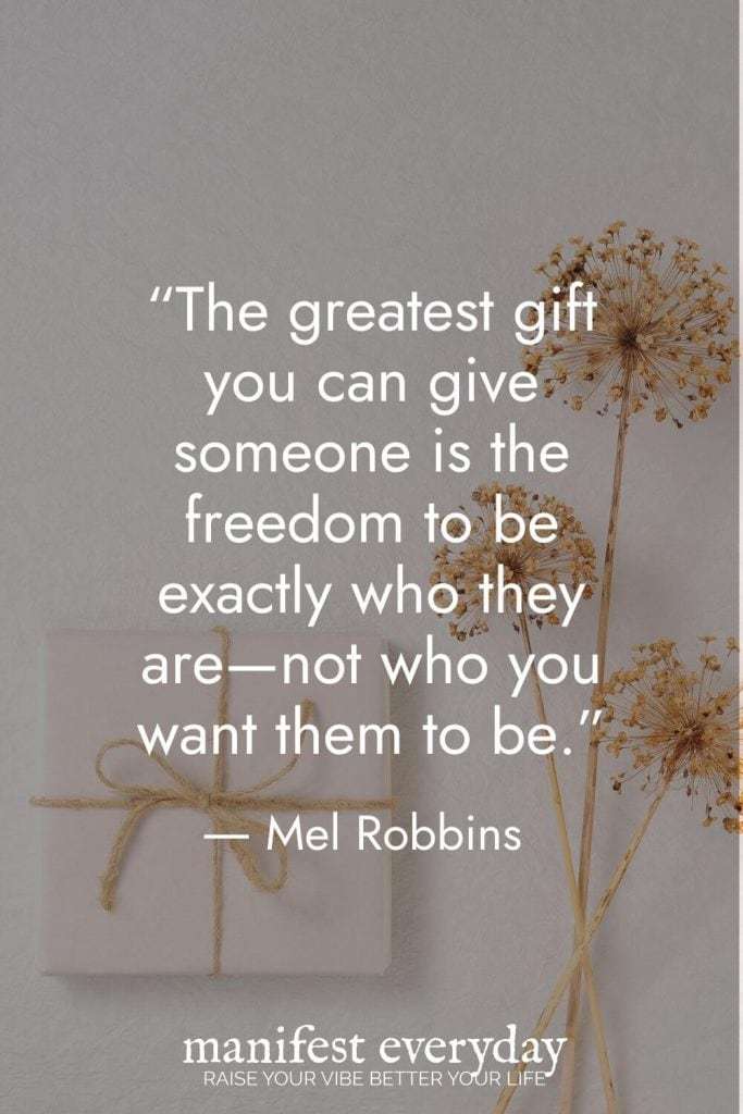 Inspirational quote by Mel Robbins against a neutral gray background with dried flowers: “The greatest gift you can give someone is the freedom to be exactly who they are—not who you want them to be.” | manifesteveryday.com