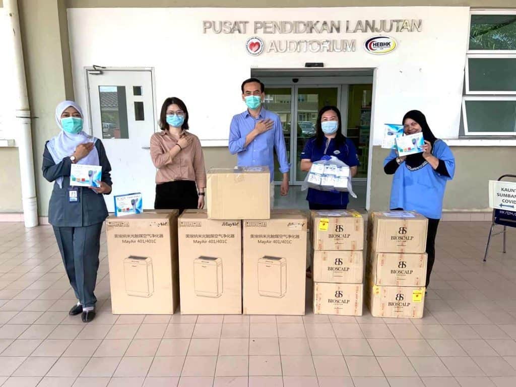 High-efficiency portable air purifiers donation at educational center, showcasing MayAir Group's commitment to health and air quality improvements.