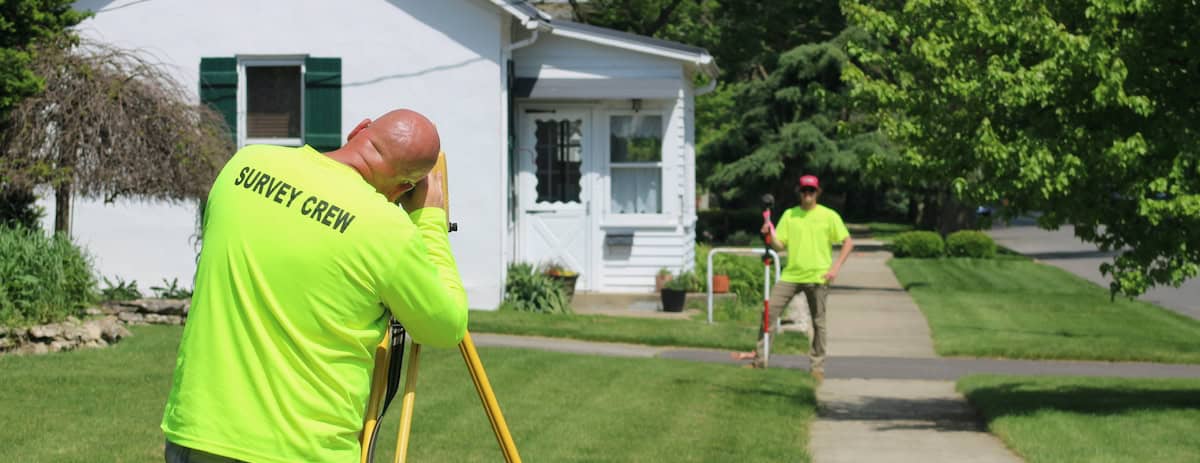 Two professionals in a land surveying career.