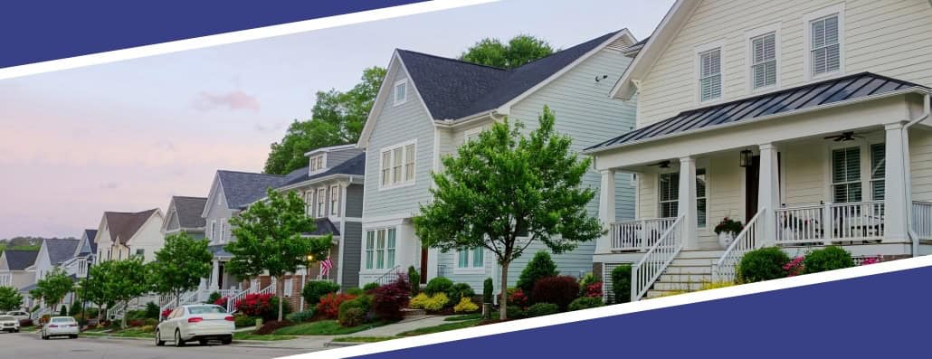 A row of houses representing the real estate market.
