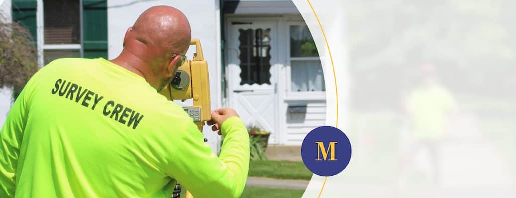 A McSteen Land Surveyor surveying property site.