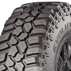 Off-road tire with rugged tread pattern for durability and traction.