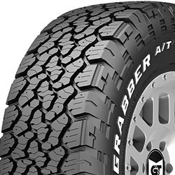 Off-road tire with rugged tread pattern for heavy-duty vehicles.