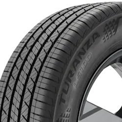 Close-up of Bridgestone Turanza LS100 tire with detailed tread pattern.