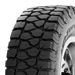 All-terrain tire with rugged tread pattern for off-road use.