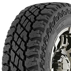 Off-road tire with rugged tread pattern for durability and traction.