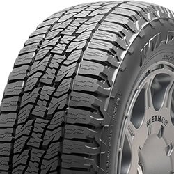 All-terrain tire with rugged tread pattern for durability and traction.