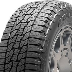 All-terrain tire with rugged tread pattern for off-road and on-road use.