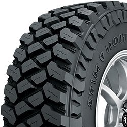Off-road tire with aggressive tread pattern for all-season use.