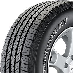 Close-up of Migo Tire Corp. tire with detailed tread pattern.