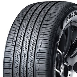 Close-up of Migo Tire Corp. car tire with detailed tread pattern.