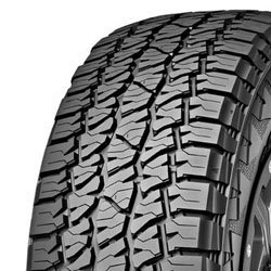 Close-up of rugged all-weather tire tread with deep grooves and sipes.