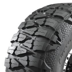 Off-road tire with rugged tread pattern for durability and traction.