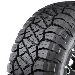 Off-road tire with rugged tread pattern for durability and traction.
