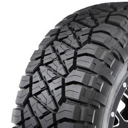 Off-road tire with rugged tread pattern for durability and traction.
