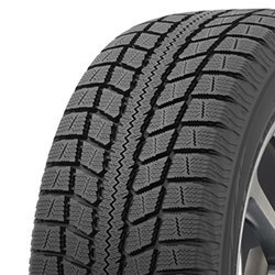 Close-up of a winter tire tread pattern with deep grooves and sipes for snow traction.