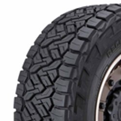 Off-road tire with rugged tread pattern for all-terrain driving.