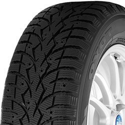Close-up of a winter tire with detailed tread pattern for snow and ice traction.
