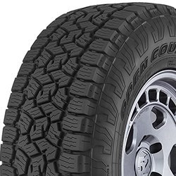 All-terrain tire with rugged tread pattern for off-road and on-road use.
