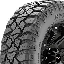 Off-road tire with aggressive tread pattern for rugged terrain.