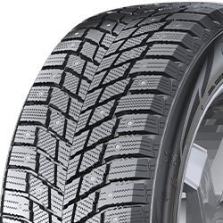 Close-up of a winter tire with detailed tread pattern for snow and ice traction.