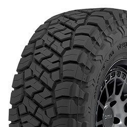Off-road tire with aggressive tread pattern for all-season use.
