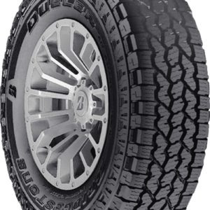 Bridgestone Dueler AT All Weather tire on a rugged vehicle.