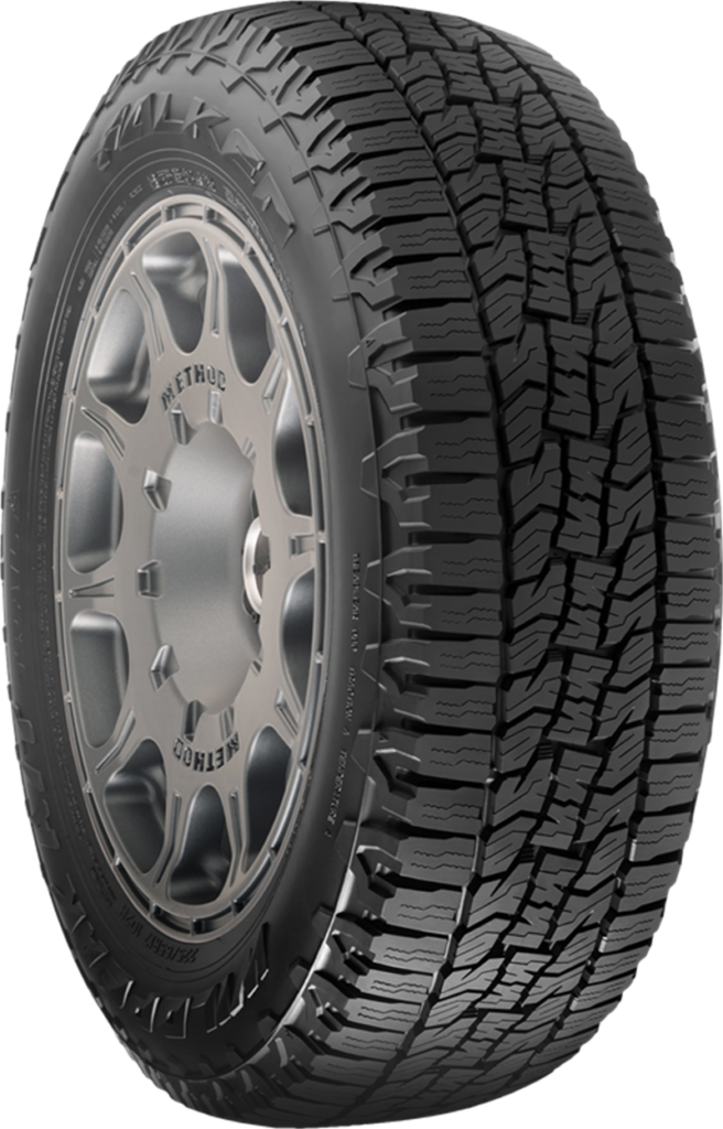 All-terrain tire with rugged tread pattern for off-road and on-road use.