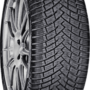 Close-up of a black tire with detailed tread pattern for all-season driving.