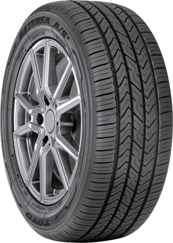 Toyo Extensa AS II P225/75R15 tire with alloy wheel on black background.