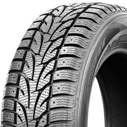 Winter tire with deep tread pattern for snow and ice conditions.