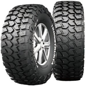 Off-road tires with aggressive tread pattern for mud terrain driving.