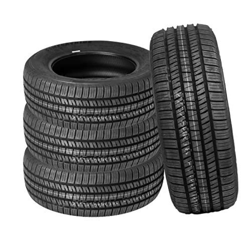 Stack of five black car tires with detailed tread patterns.