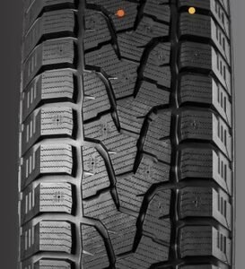 Winter tire with detailed tread pattern for snow and ice conditions.