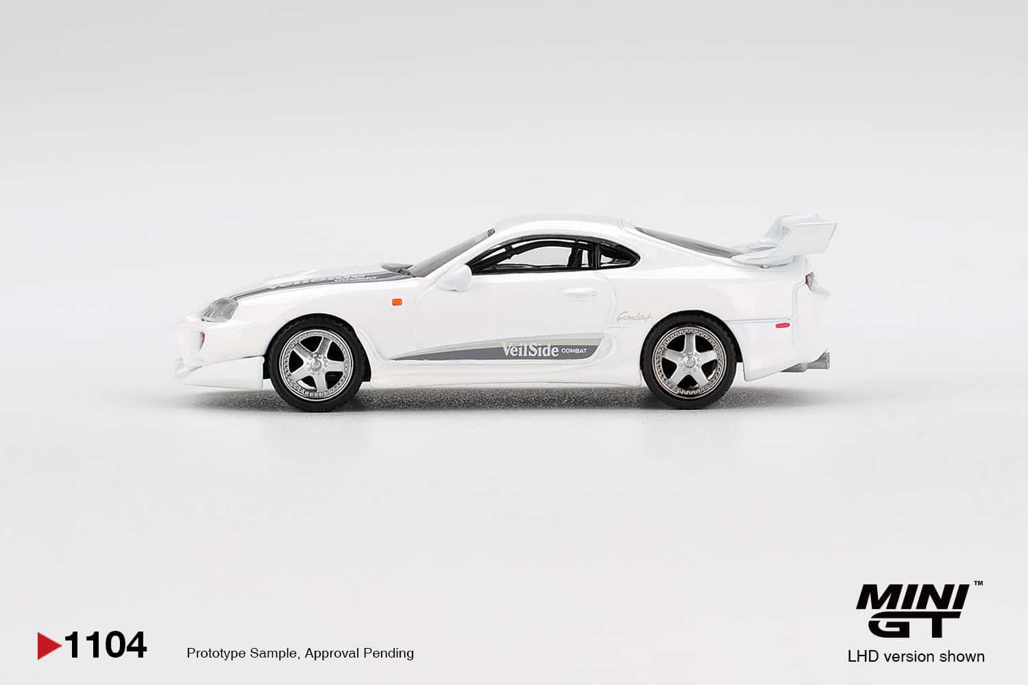Mini64 diecast Toyota Supra VeilSide Combat V-I White model car.