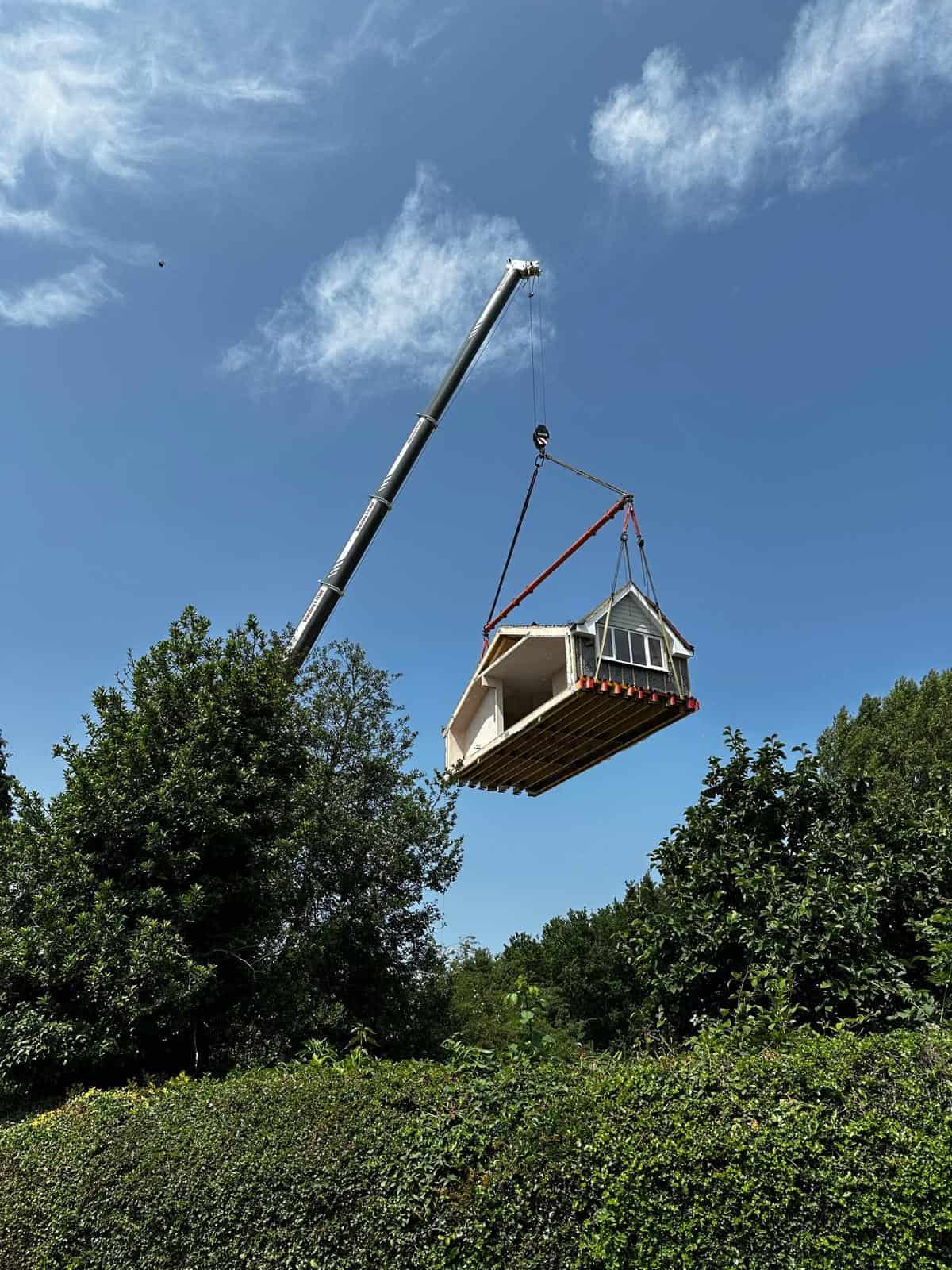 A new floor built in the Moduloft factory being craned onto a home.