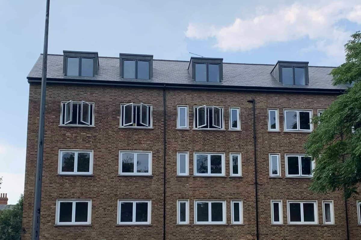 Brixton Road (SW9): rooftop apartments above tenanted flats, after