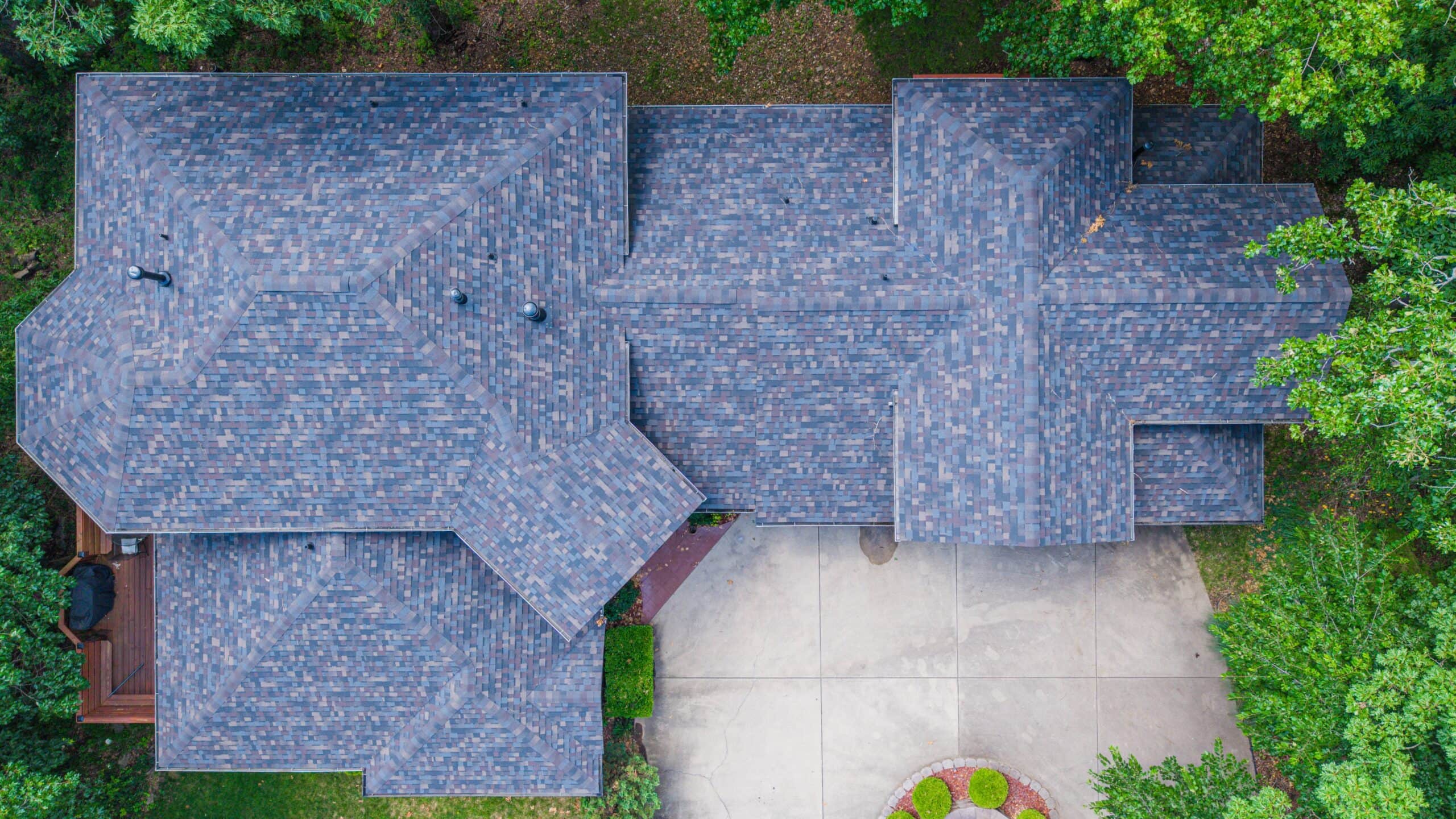 Aerial view of a residential roof with new asphalt shingles in Minnesota.