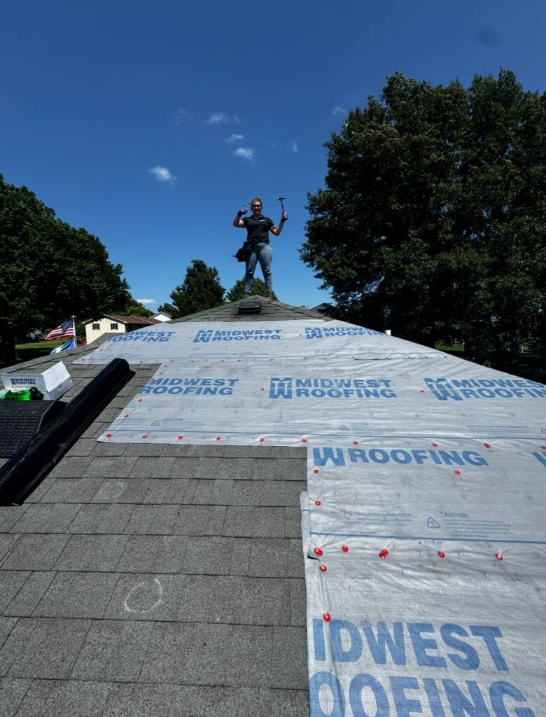 Roofing installation by Midwest Roofing on residential home in progress.