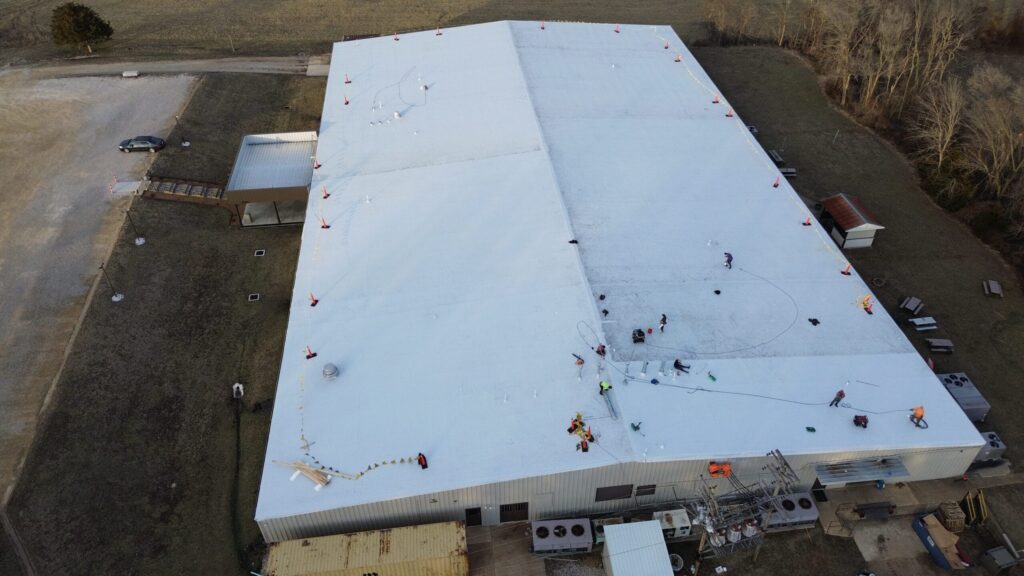 Aerial view of a large commercial roofing project by Midwest Roofing, showcasing professional instal.