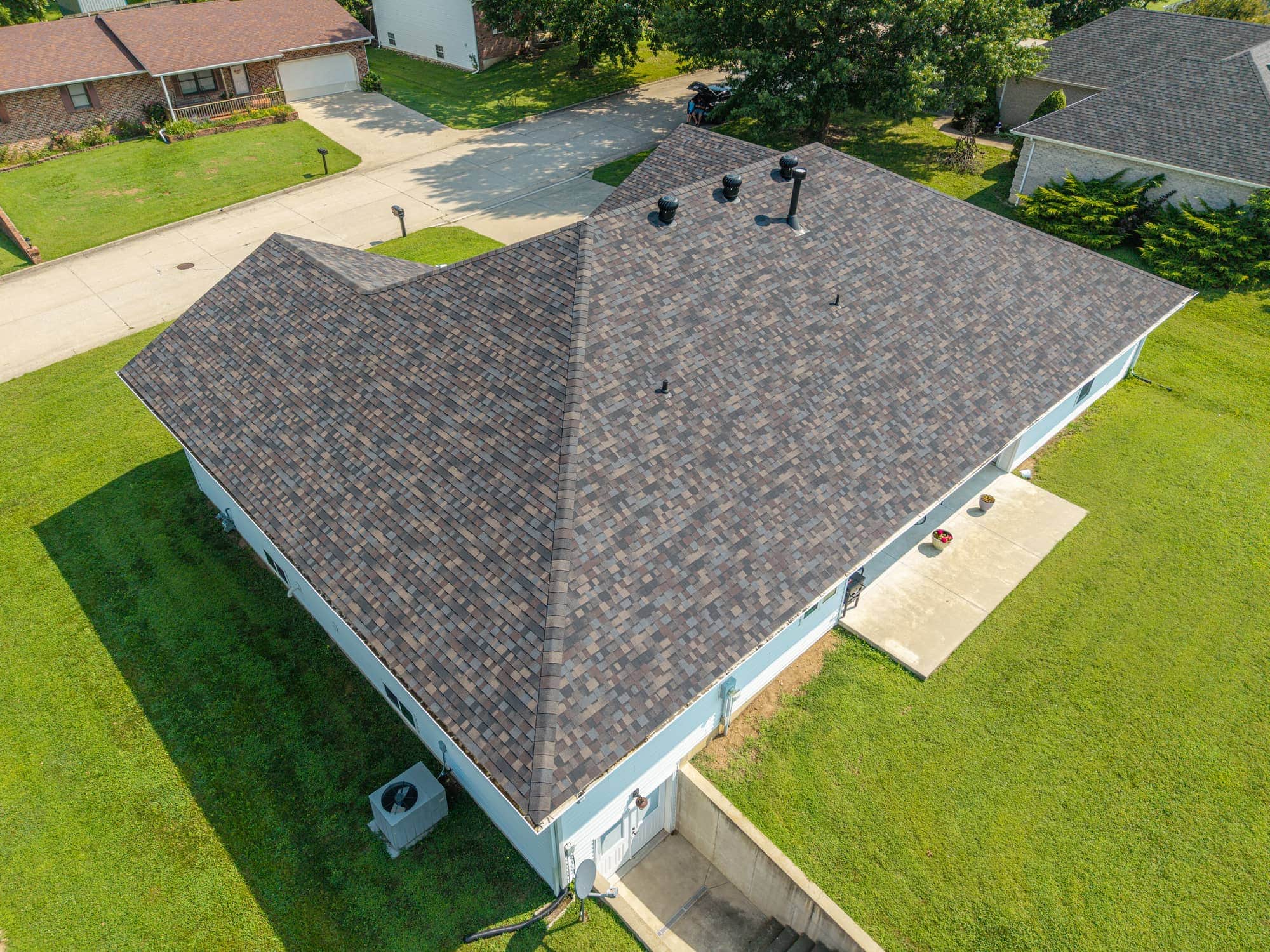 New asphalt shingle roof installed on residential home in California, MO.