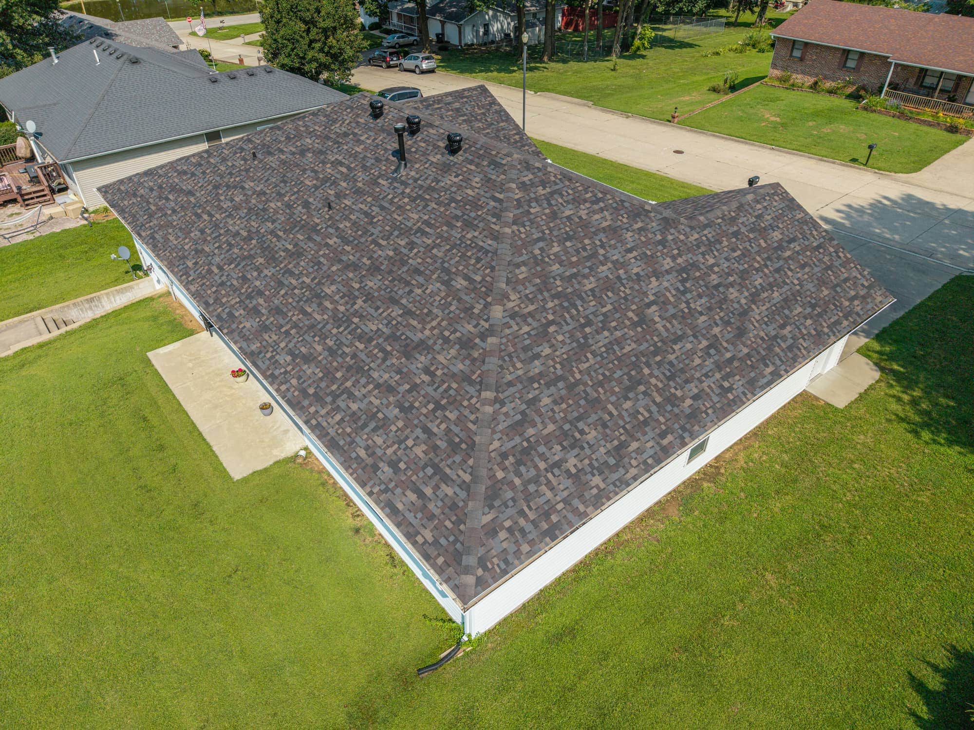 Newly replaced asphalt shingle roof on a residential home in California, MO.