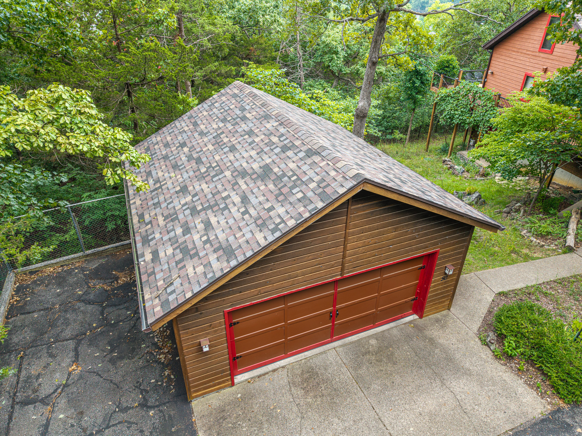 New asphalt shingle roof on residential garage in Camdenton, MO.