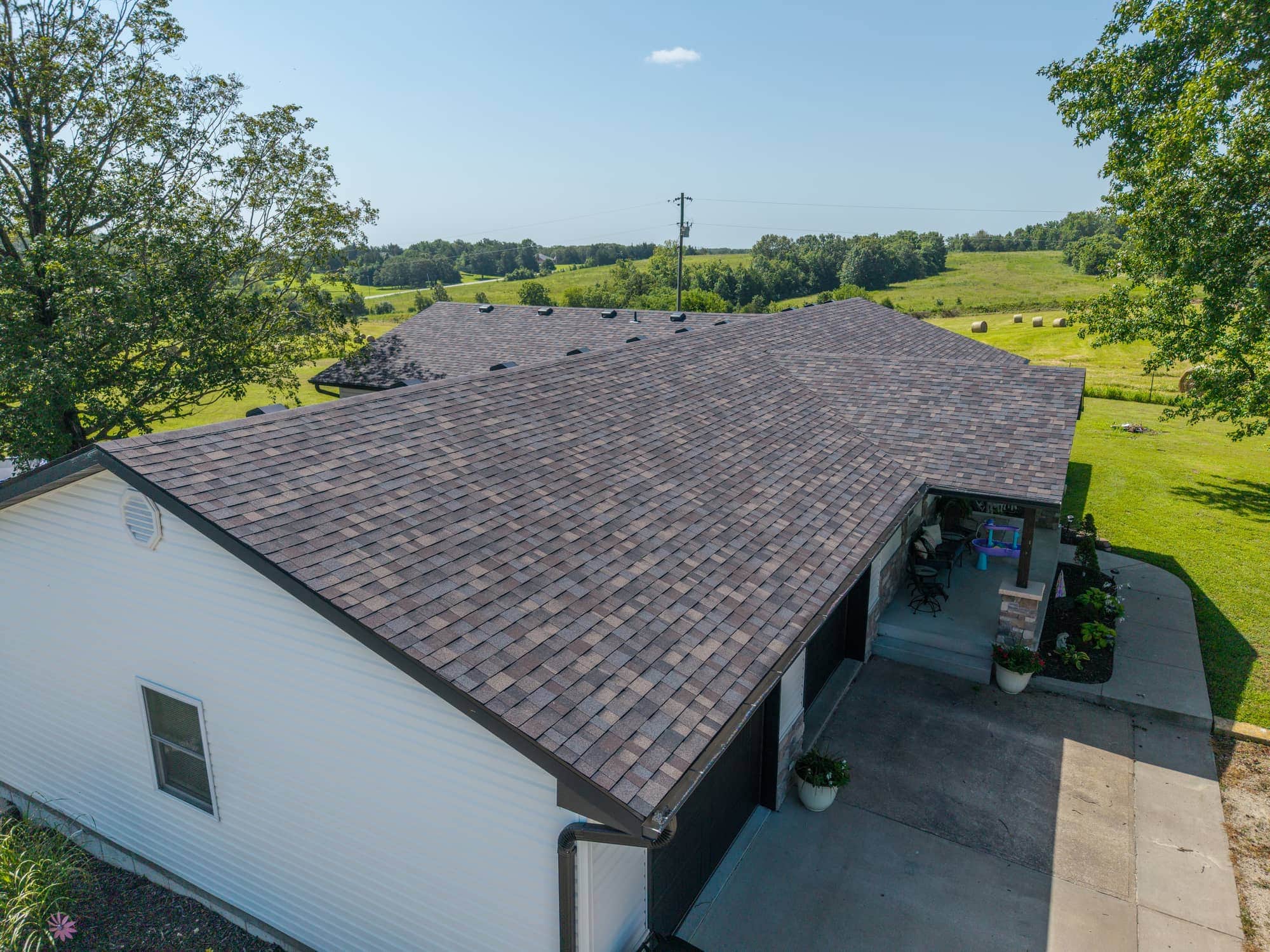 New asphalt shingle roof on a residential home in Eugene, Missouri.