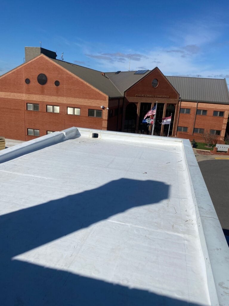 New white TPO roof on the Phelps County Historical Museum, looking toward the Phelps County Courthouse in Rolla