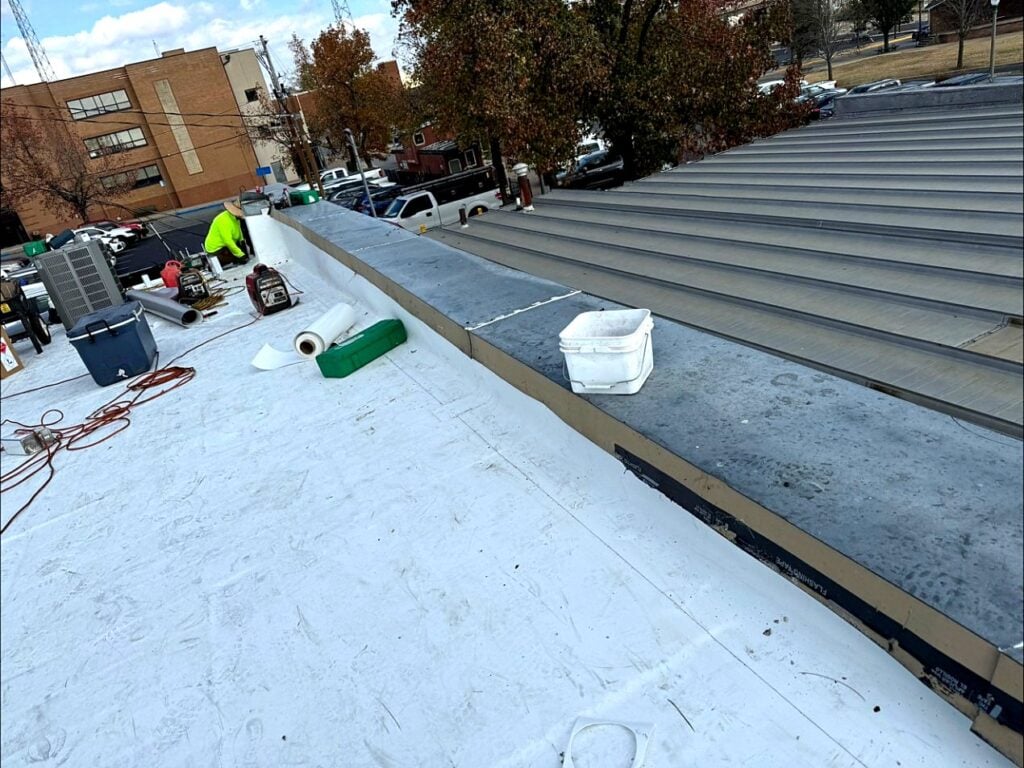 New white TPO roof at the parapet of a downtown Rolla building