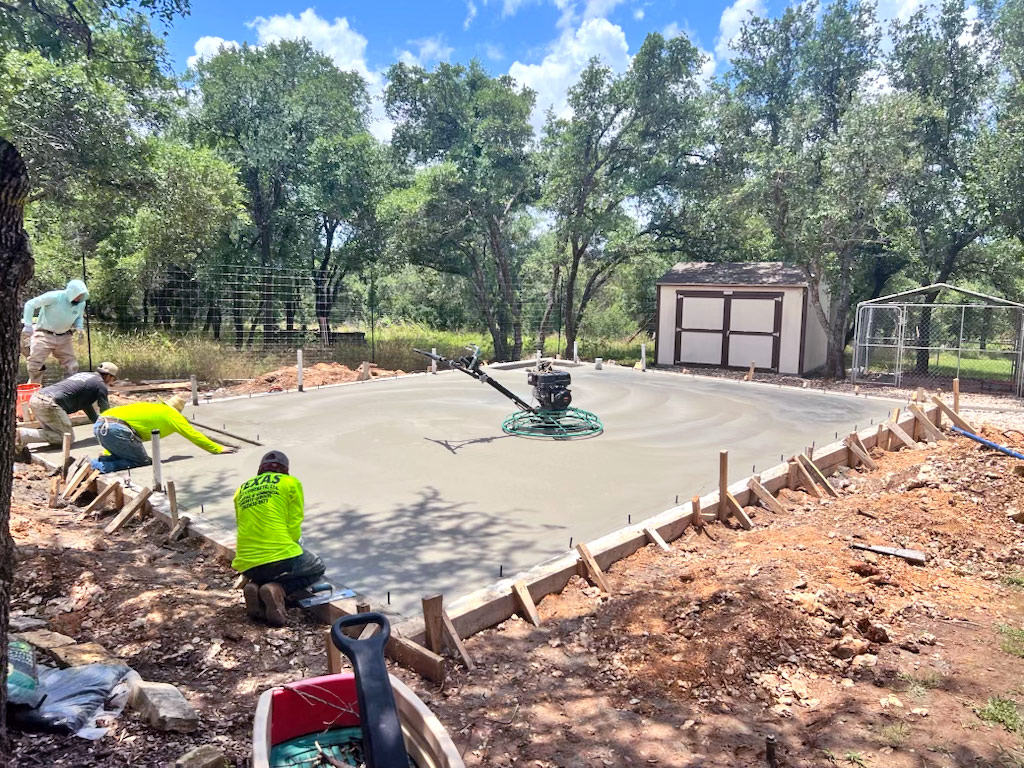 Concrete slab construction in wooded area