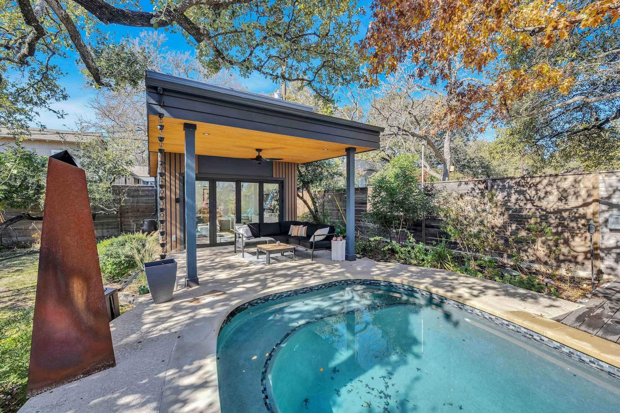 Modern backyard patio with pool oasis