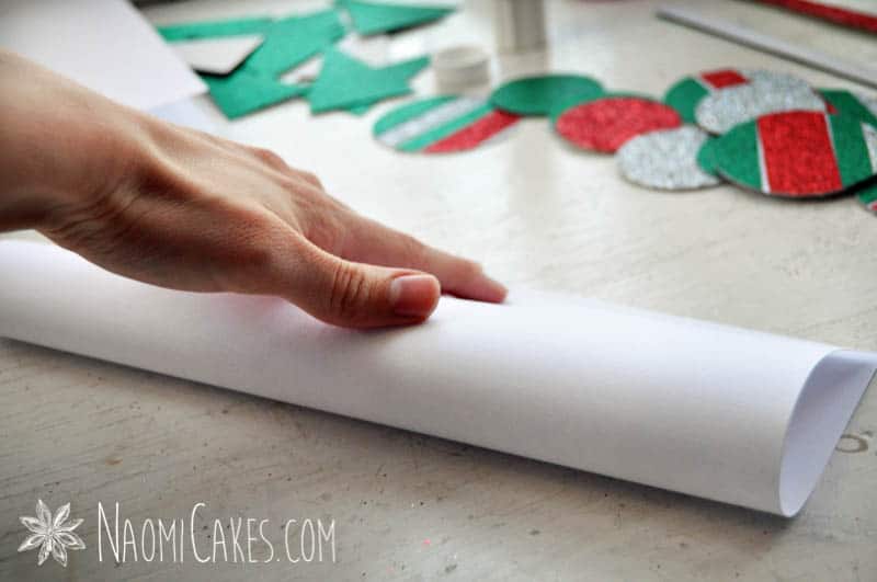 a hand folding white card stock