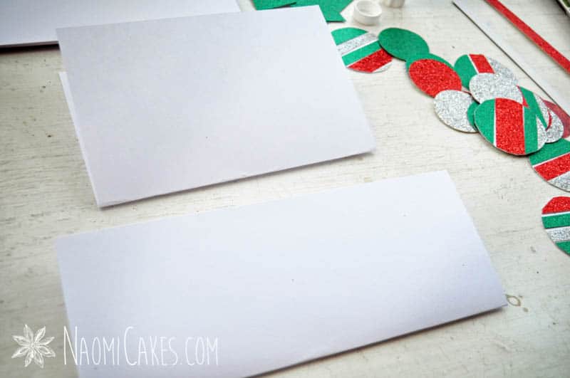 folded pieces of white card stock for card making